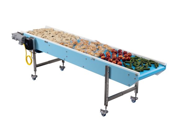 A DynaClean S Series Full washdown conveyor conveying apples, vegetables, breakfast sandwiches, and other foods